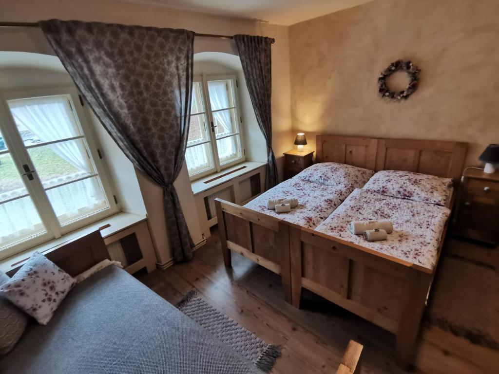 Postel nebo postele na pokoji v ubytování Apartmány U Koudelníka