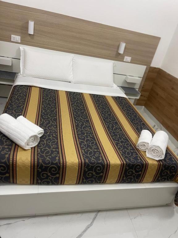 Postel nebo postele na pokoji v ubytování Roma Palace