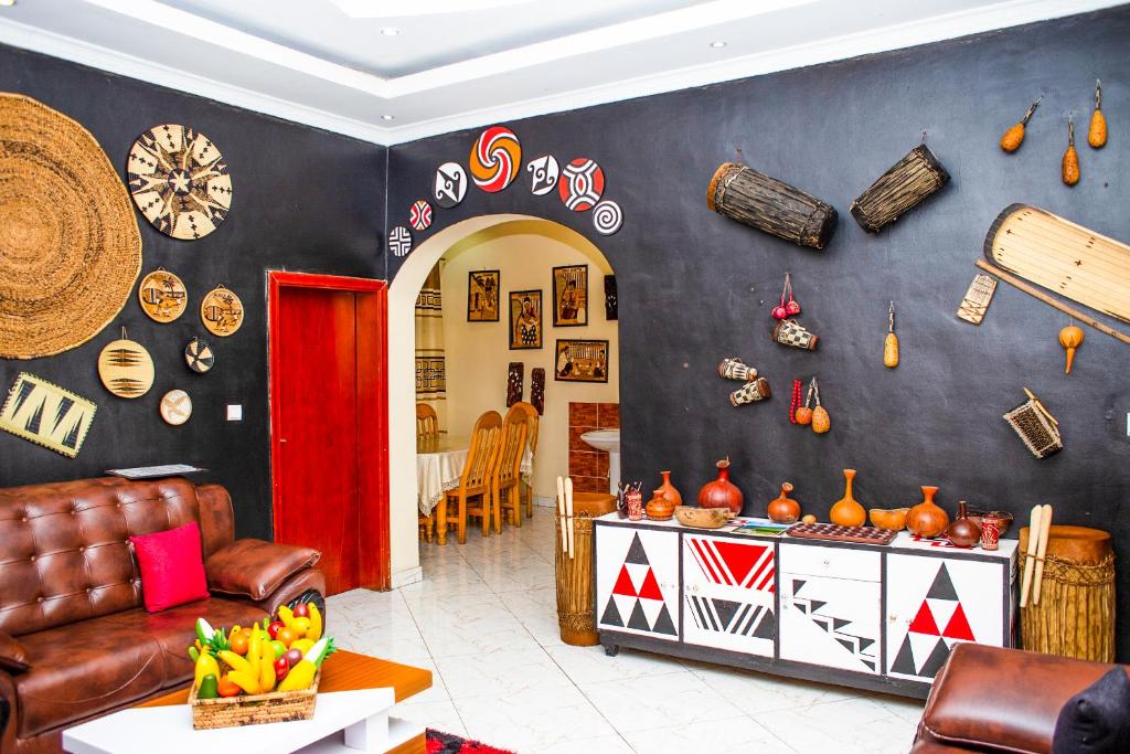 a living room with a couch and a table at Virunga Homestays in Ruhengeri