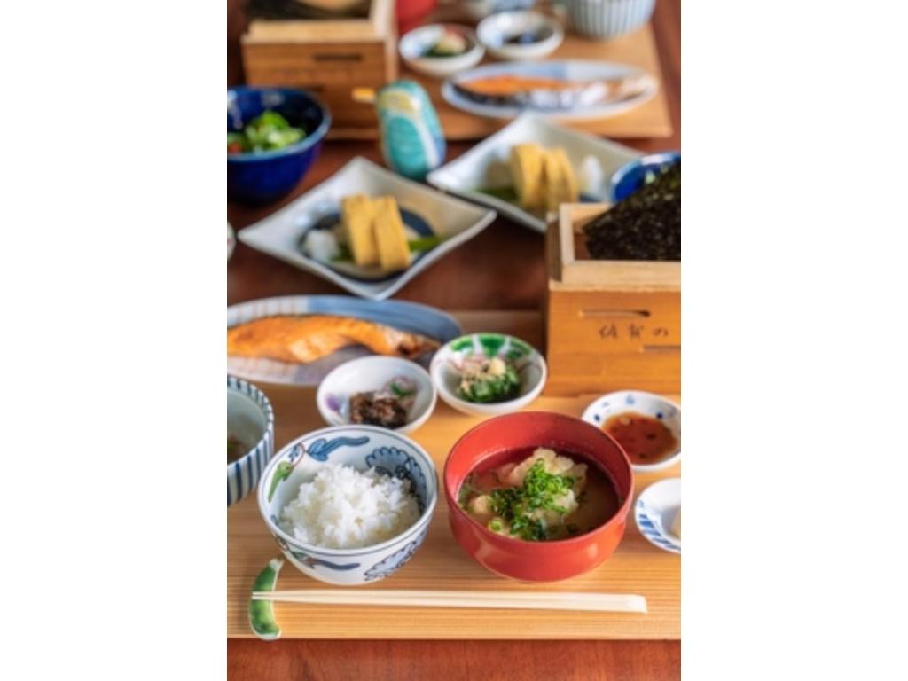 a table with dishes of food on a table at Ryokan Akebono - Vacation STAY 91891v in Saga