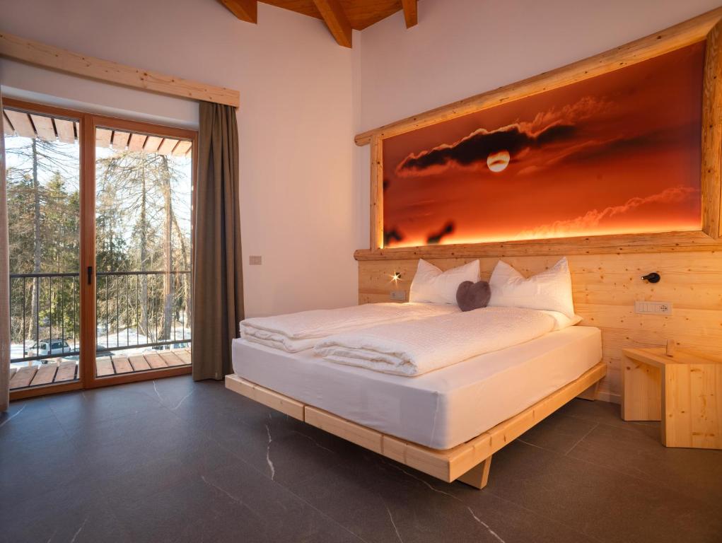 Postel nebo postele na pokoji v ubytování Residence Lavina