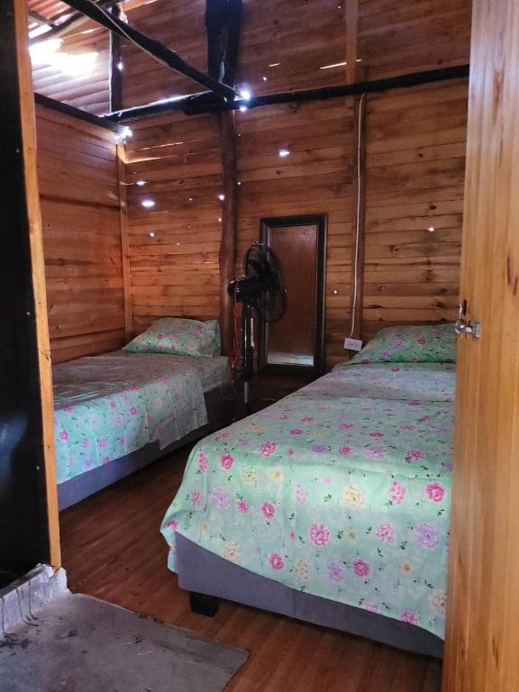 Postel nebo postele na pokoji v ubytování Eco hotel Mar De Ensueño