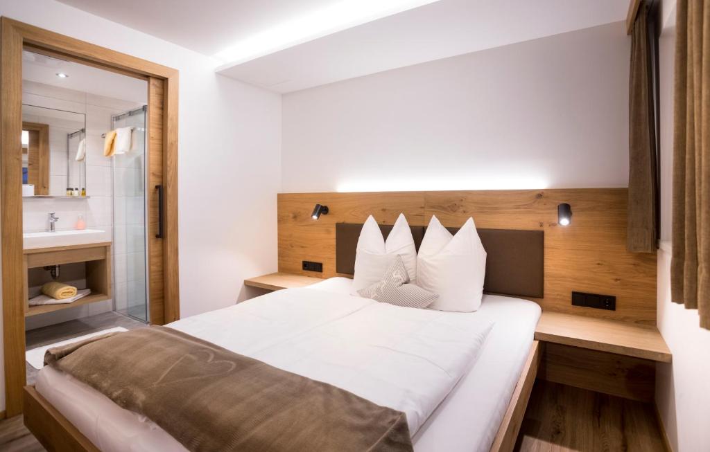 Postel nebo postele na pokoji v ubytování Haus Bstieler