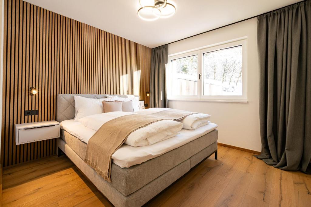 Postel nebo postele na pokoji v ubytování Kirchner's Apartments