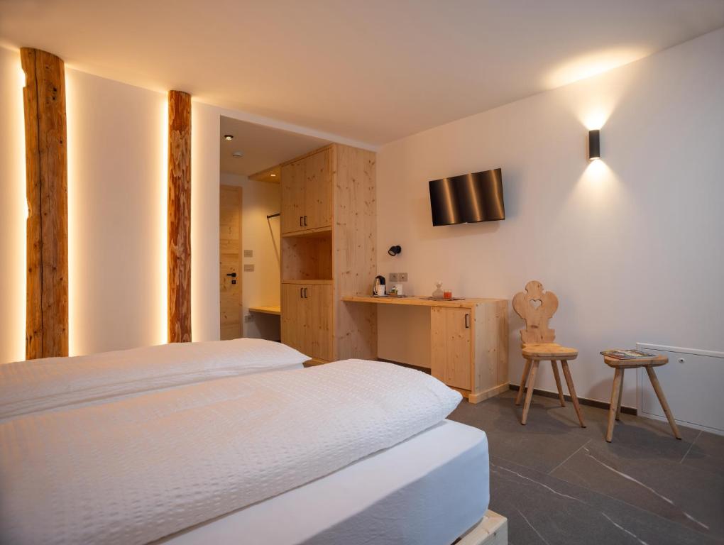 Postel nebo postele na pokoji v ubytování Residence Lavina