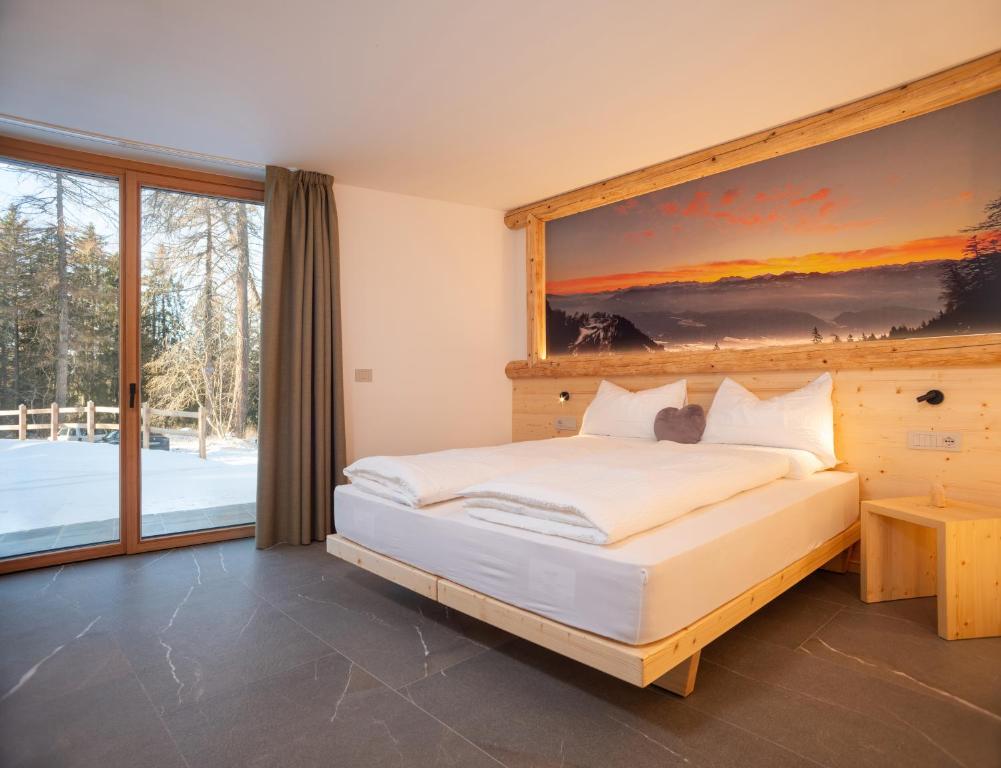 Postel nebo postele na pokoji v ubytování Residence Lavina