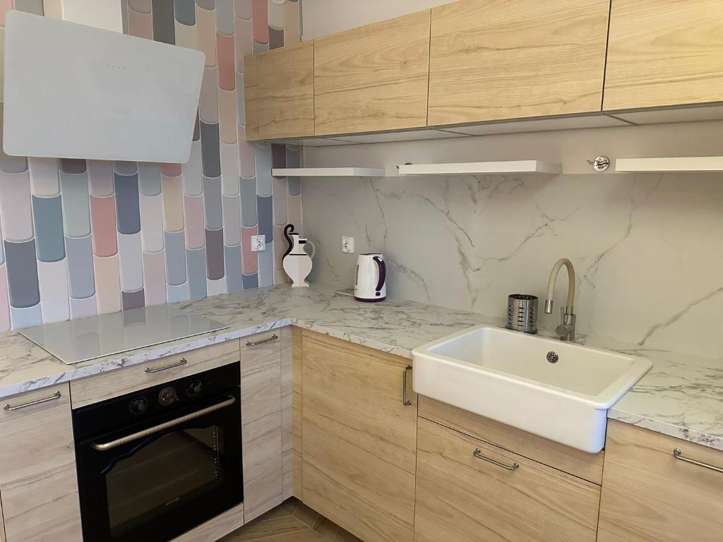 Kuchyň nebo kuchyňský kout v ubytování Apartament na Wzgórzu Piaskowy