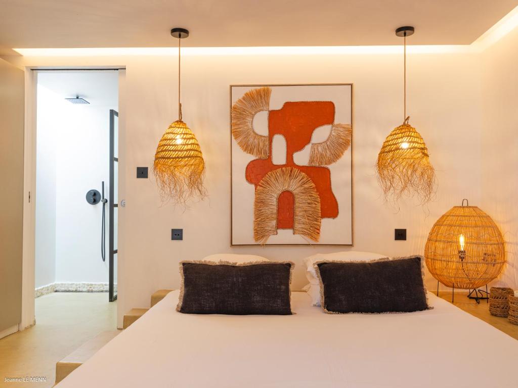 Postel nebo postele na pokoji v ubytování Le Bungalow Gypset