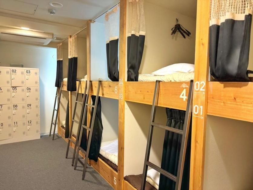 TV a/nebo společenská místnost v ubytování Santiago Guesthouse Hiroshima