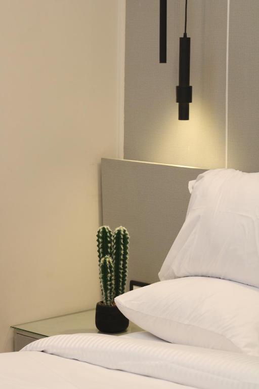 Postel nebo postele na pokoji v ubytování Elite Hotel
