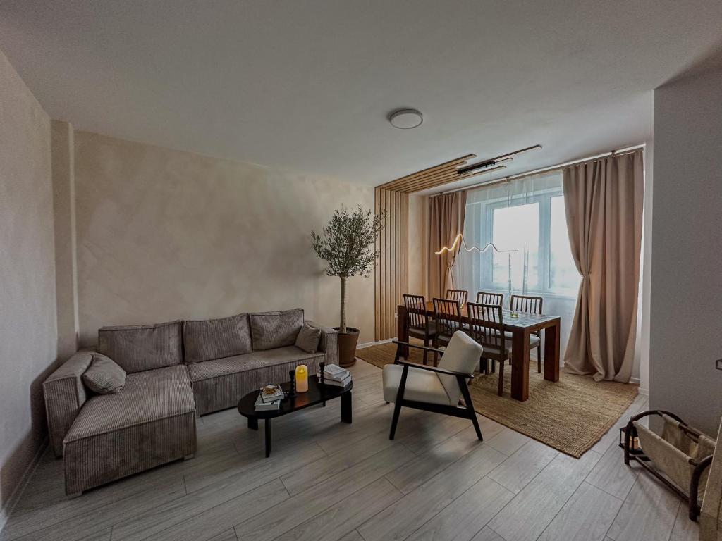 a living room with a couch and a table at Martha's House in Alba Iulia