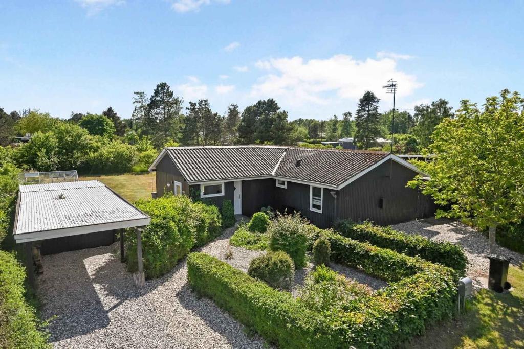 an aerial view of a house with a garden at Lovely Cottage Full Of Holiday Atmosphere in Rødby
