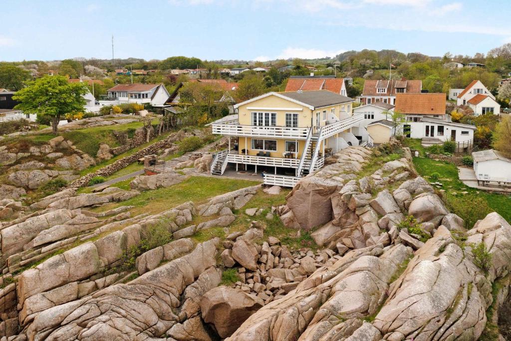 an aerial view of a house on a rocky hill at Holiday Apartment On The Bornholm Cliffs in Allinge