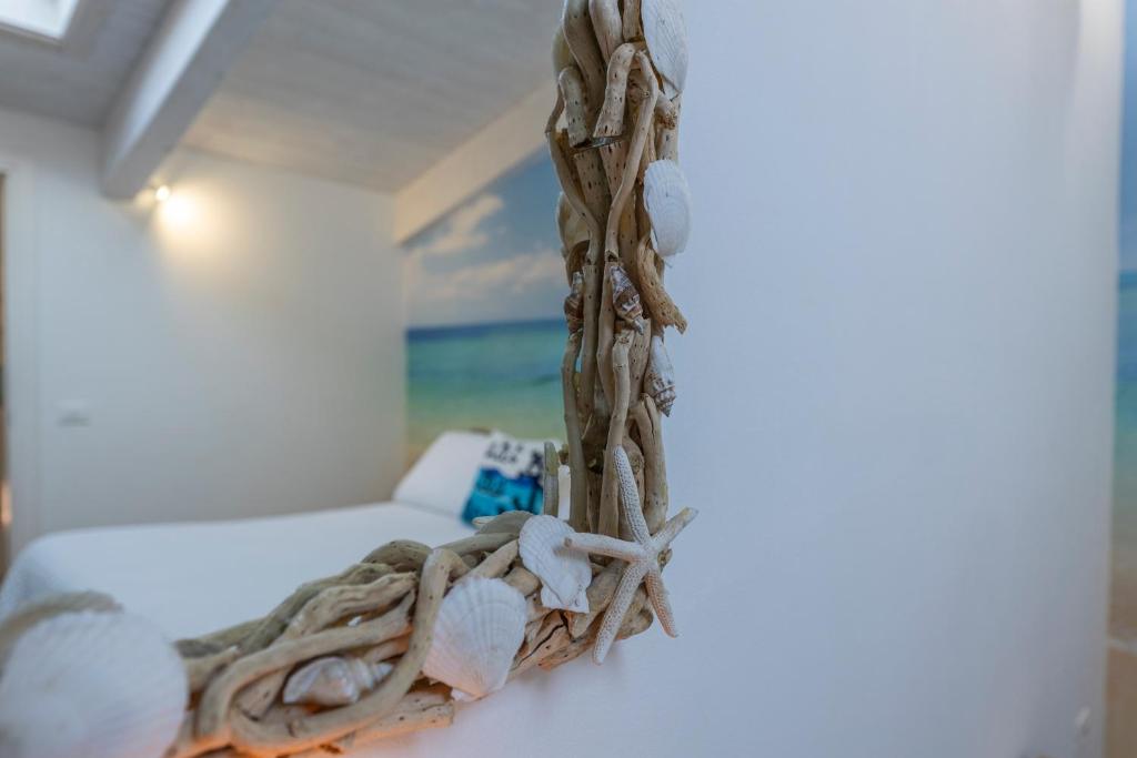 Postel nebo postele na pokoji v ubytování Acquamarina b&b
