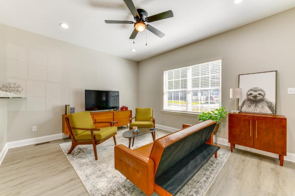 a living room with furniture and a ceiling fan at Near Shopping and Dining Pet-Friendly Dallas Apt! in Gastonia