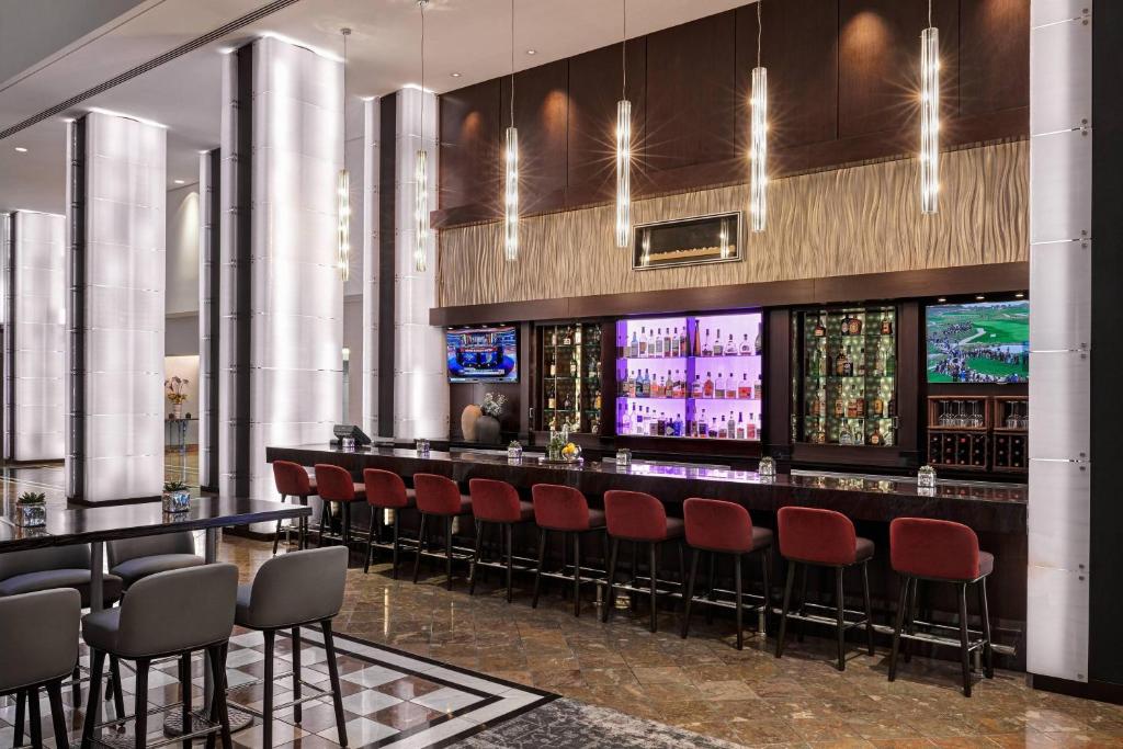 a bar with red chairs in a casino at JW Marriott San Francisco Union Square in San Francisco