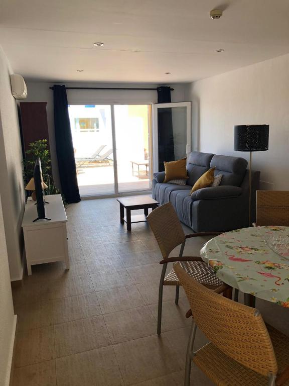 A seating area at Casa Veratense Atico Vera Naturista is 100 feelgood in Vera Playa