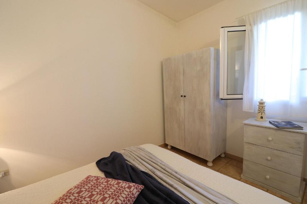 Łóżko lub łóżka w pokoju w obiekcie Casa Regina Residence Torre Santo Stefano in Otranto 3 places
