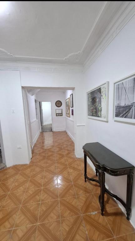 a room with a piano in the middle of it at Casa Martín in Bogotá