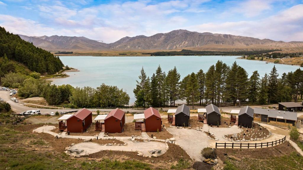 an aerial view of a group of buildings next to a lake at The Huts at Lakes Edge in Lake Tekapo