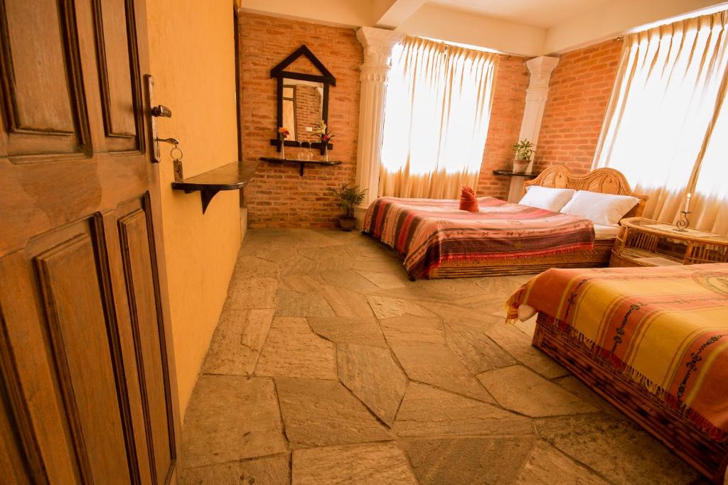 Letto o letti in una camera di Peace Eye Guest House