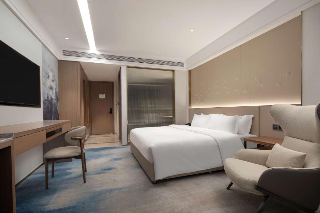 Postel nebo postele na pokoji v ubytování Doubletree By Hilton Altay Fuyun