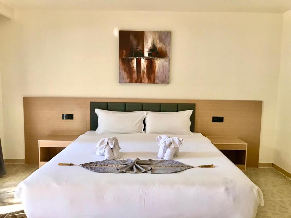 Postel nebo postele na pokoji v ubytování Vbeach Resort