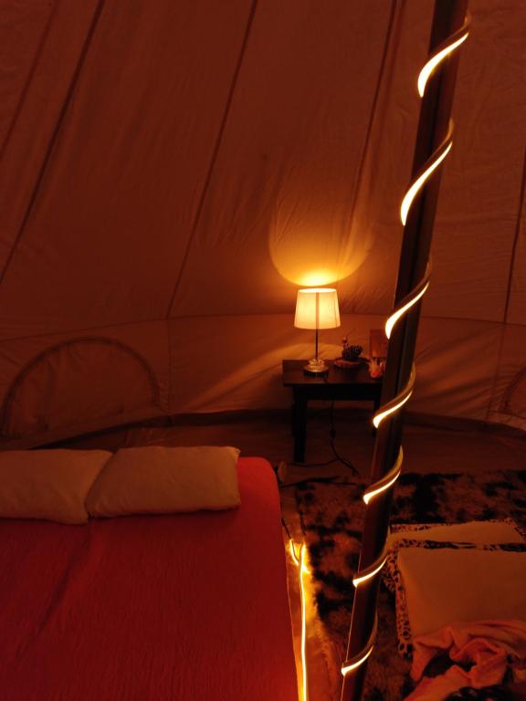 Postel nebo postele na pokoji v ubytování Glamping Xicotepec