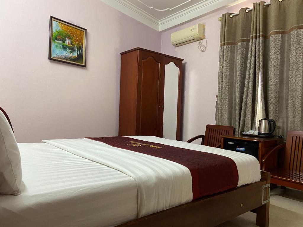 Postel nebo postele na pokoji v ubytování Hong Ha Airport Hotel