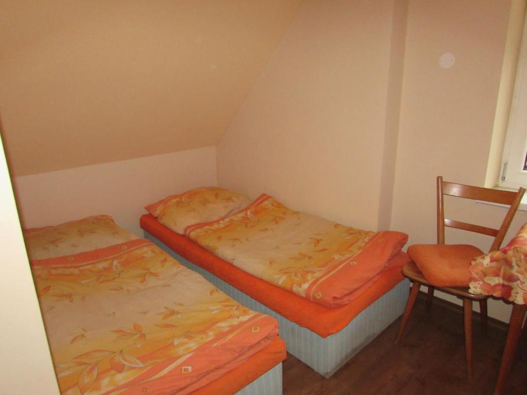 Postel nebo postele na pokoji v ubytování Rybářská Chata U Sumce
