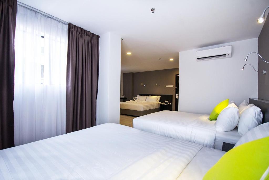 Postel nebo postele na pokoji v ubytování Manhattan Hotel Ipoh