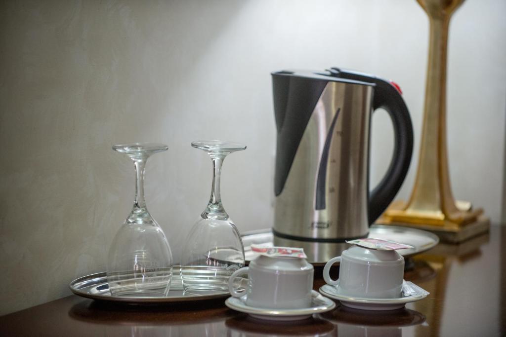 Příslušenství pro přípravu čaje a kávy v ubytování Hotel Rexton