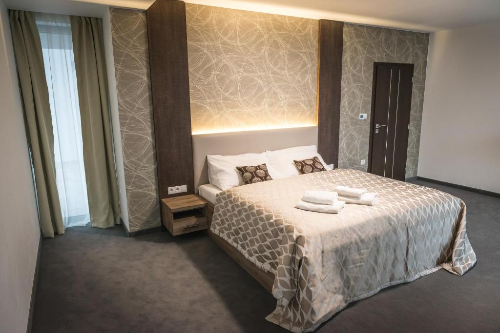 Un pat sau paturi într-o cameră la Guest House Frizzante