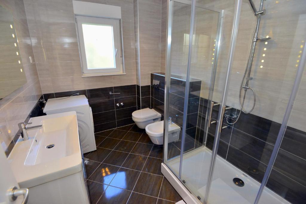 Kúpeľňa v ubytovaní Apartments Villa Coratina