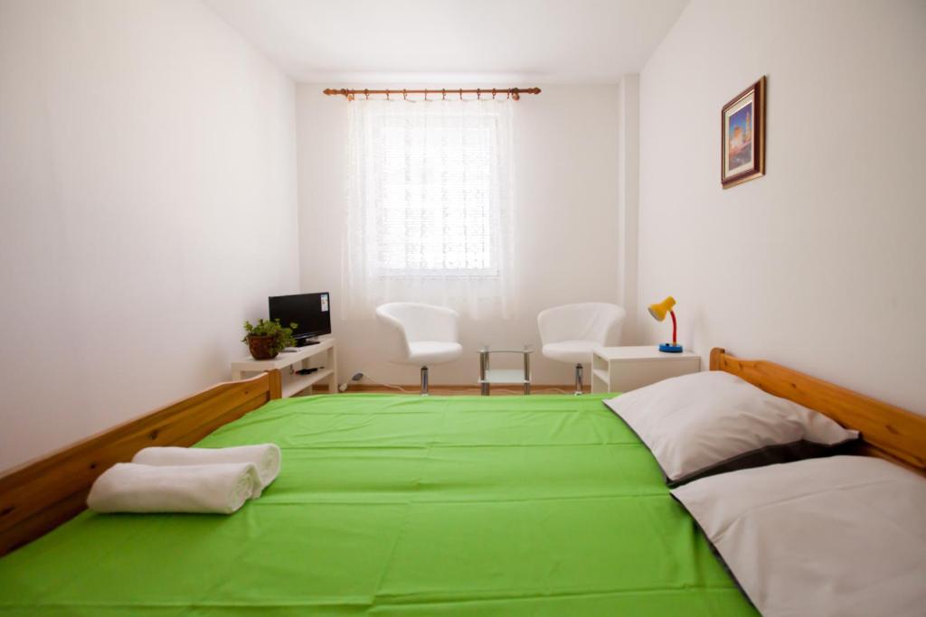 Posteľ alebo postele v izbe v ubytovaní Friendly People's Guest House
