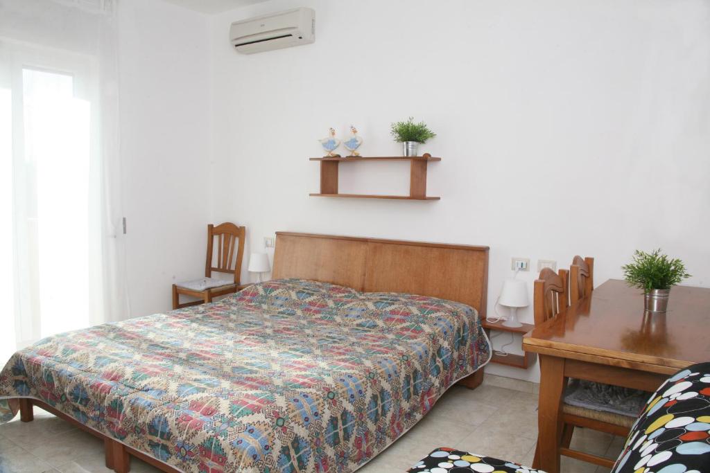 Postel nebo postele na pokoji v ubytování B&B Gelsimori