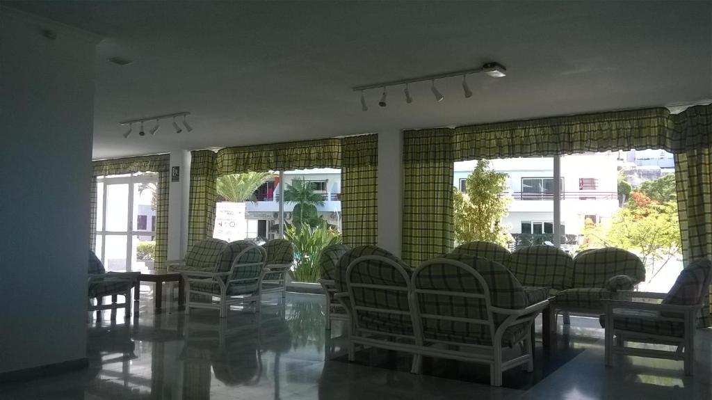 A seating area at First Line Beach Apartment with Ocean View La Arena