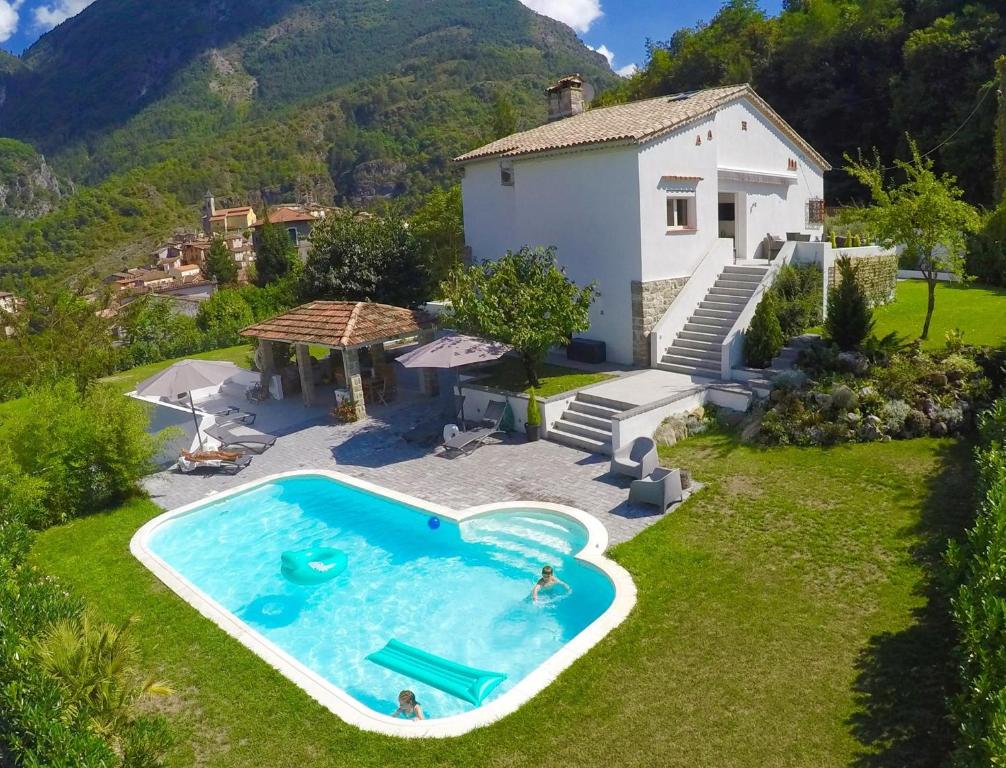 an aerial view of a house with a swimming pool at Les Hortensias in Lantosque