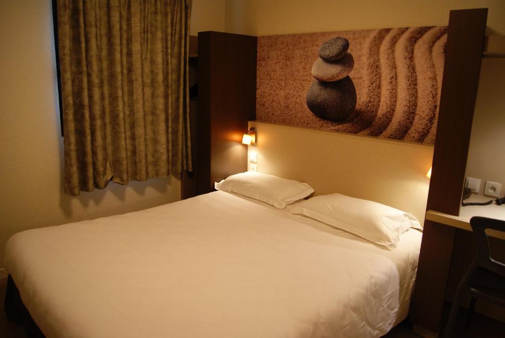 Postel nebo postele na pokoji v ubytování The Originals City, Hôtel Clermont-Ferrand Sud Aubière
