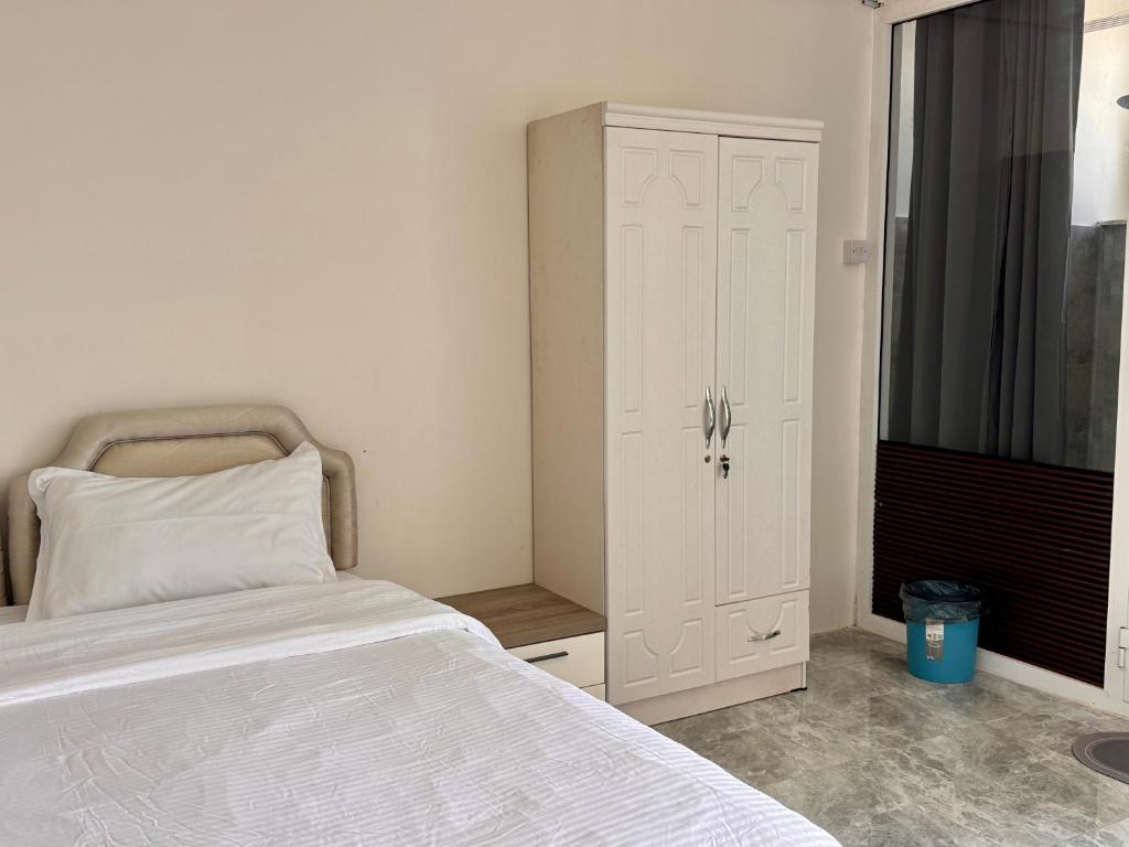 Voodi või voodid majutusasutuse Wadi Shab Beach Villa toas