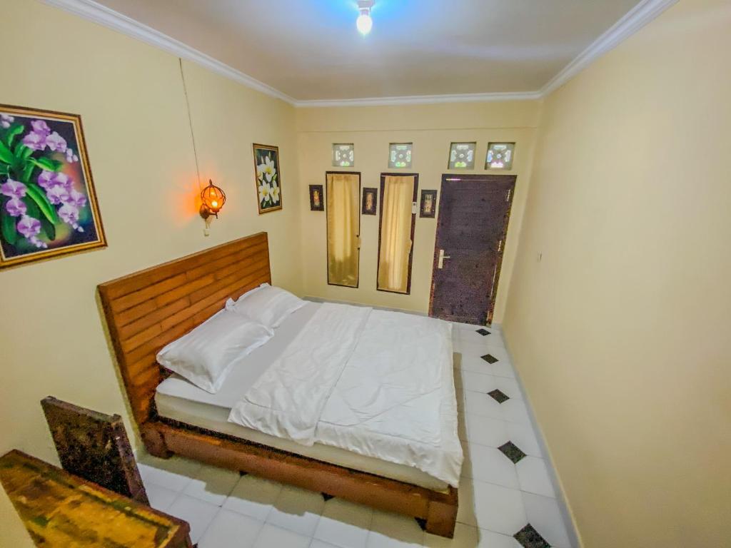 Postel nebo postele na pokoji v ubytování D'ulun Carik Homestay