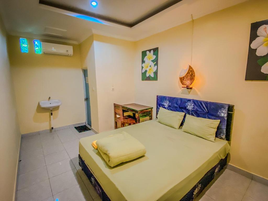 Postel nebo postele na pokoji v ubytování D'ulun Carik Homestay