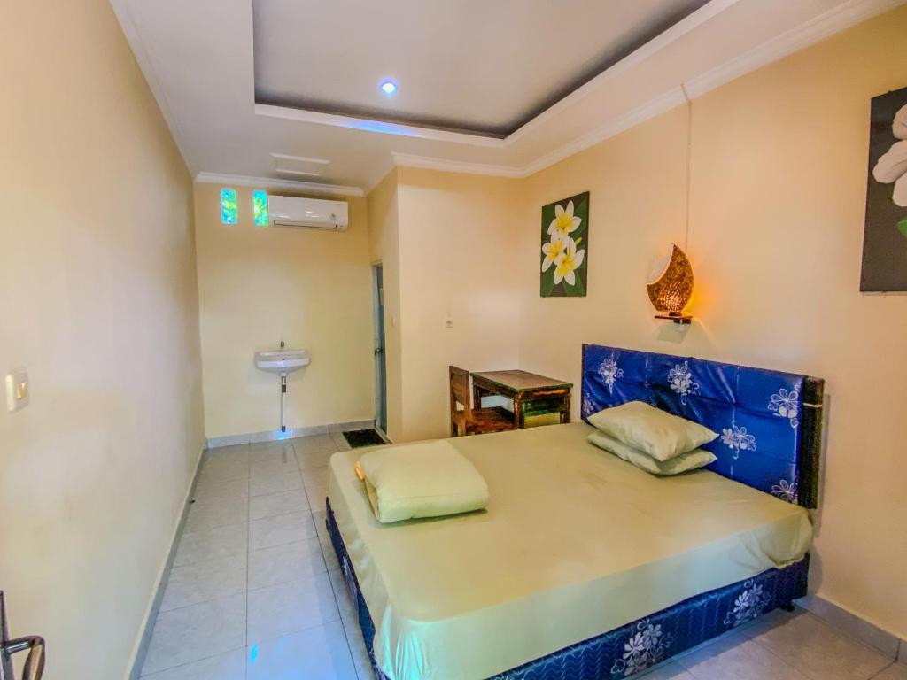 Postel nebo postele na pokoji v ubytování D'ulun Carik Homestay