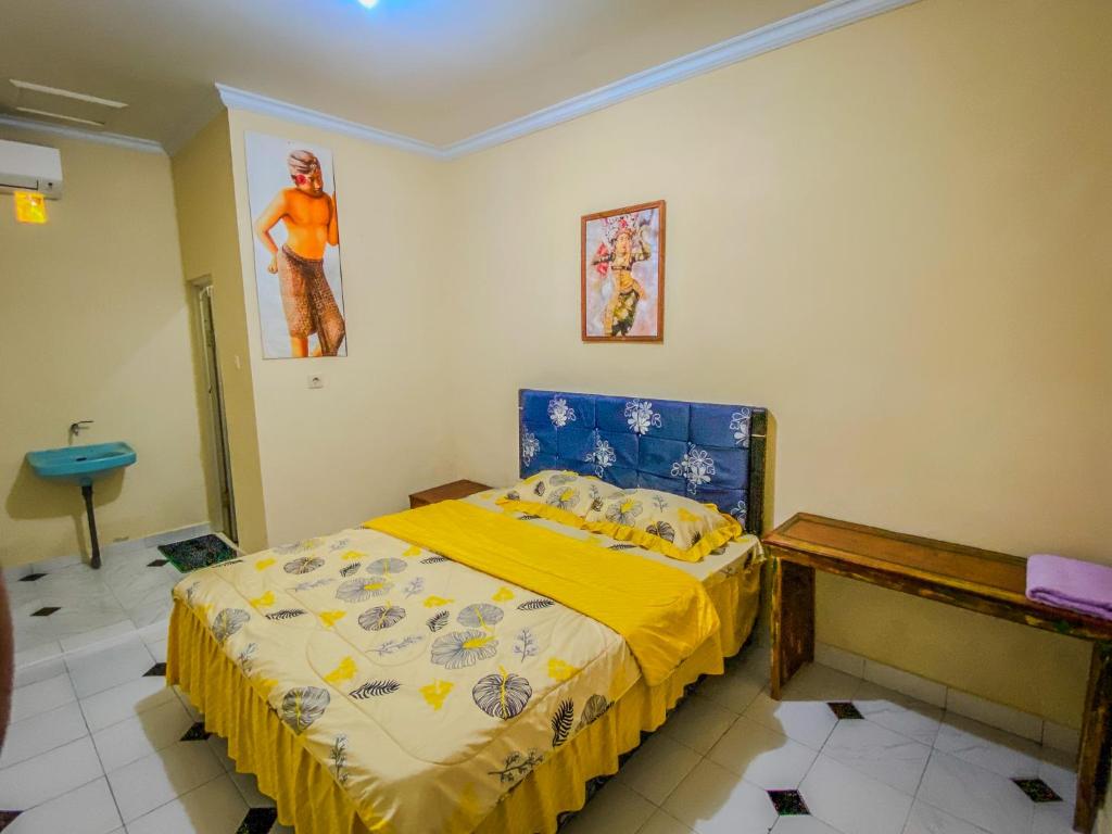Postel nebo postele na pokoji v ubytování D'ulun Carik Homestay