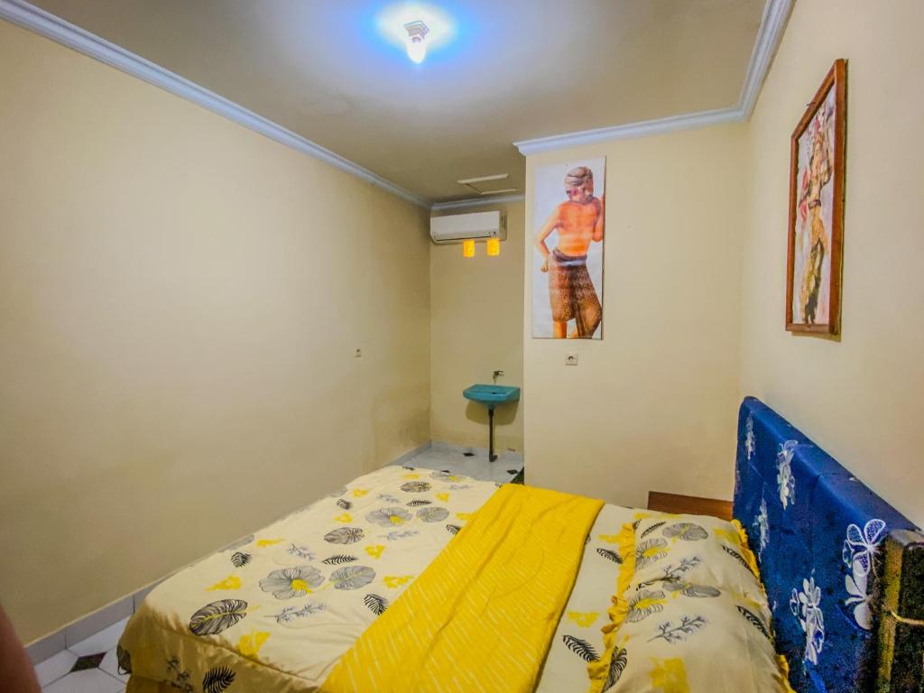 Postel nebo postele na pokoji v ubytování D'ulun Carik Homestay