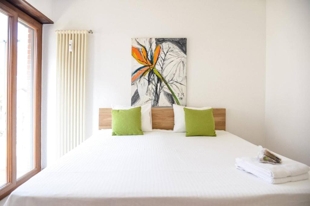 Postel nebo postele na pokoji v ubytování Casa Melide Seeblick