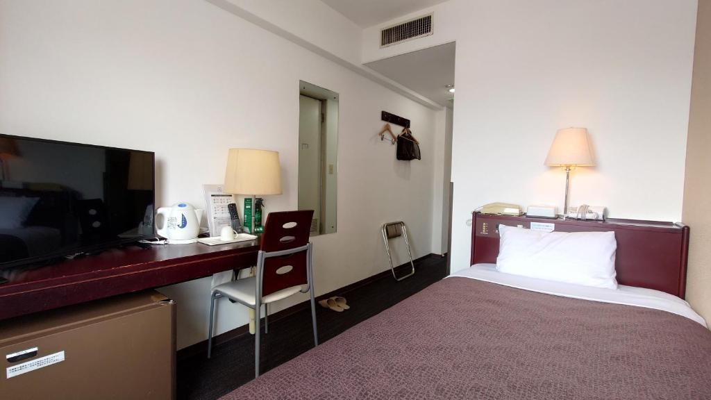 Postel nebo postele na pokoji v ubytování Select Inn Hamamatsu Ekimae