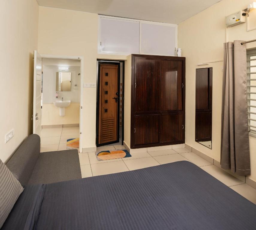 Postel nebo postele na pokoji v ubytování Chitralayam Home stay