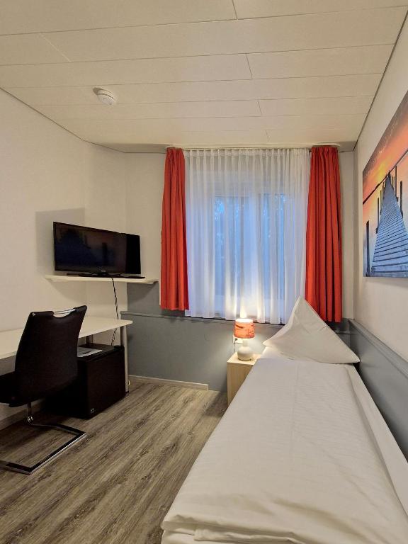 TV a/nebo společenská místnost v ubytování Hotel Mäuerle
