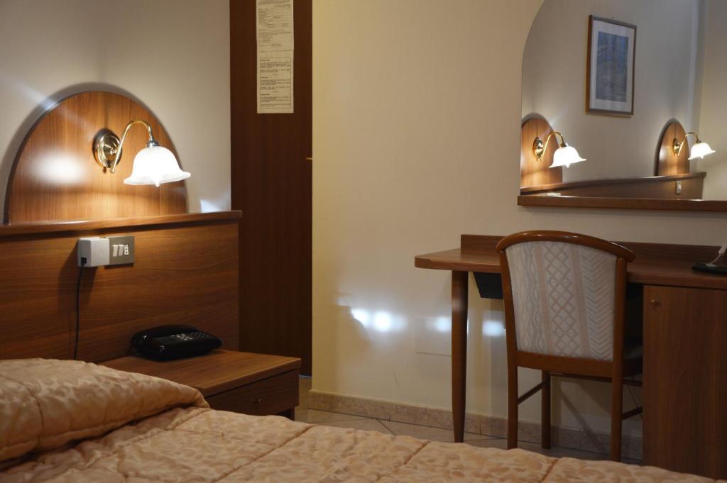 Postel nebo postele na pokoji v ubytování Hotel Rocco